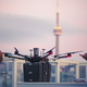 The drone during testing, with the CN Tower in the background.
